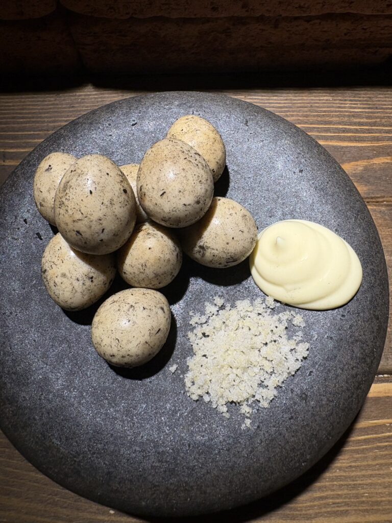 Quail eggs grilled in straw with mayonnaise