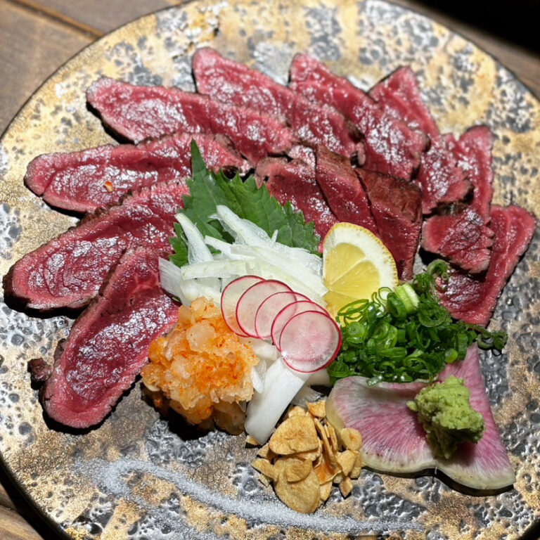 Premium Wagyu beef round meat grilled over straw with homemade ponzu sauce and condiments