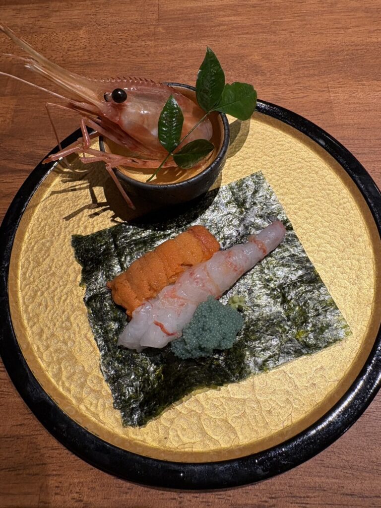 Luxurious hand roll with sea urchin and spot prawns